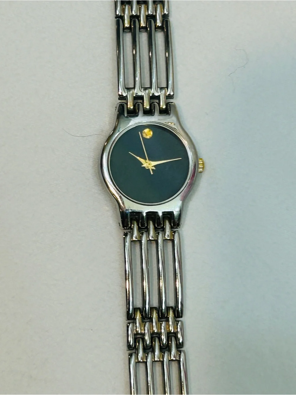 Women's Silver Bracelet Watch with Black Dial and Gold Accents